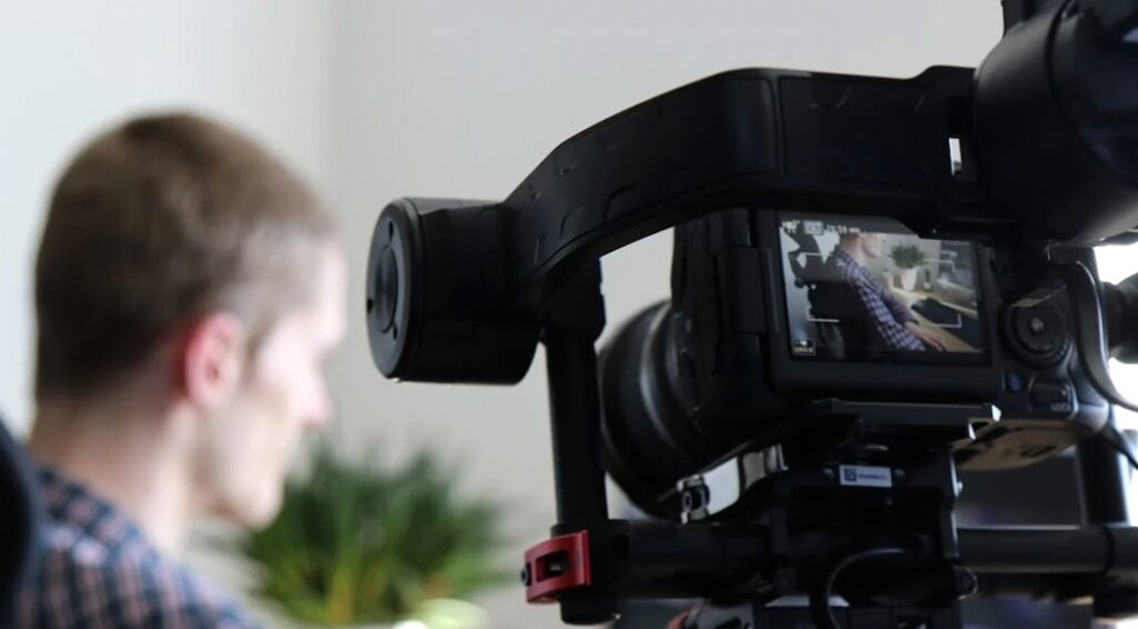 an unseen videographer shooting a medical professional making healthcare explainer videos